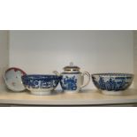 A blue and white tea pot and cover, two pearl ware blue and white bowls and another polychrome (