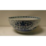 A first period Worcester blue and white bowl, 23cm (9 in) diameter  Some wear to the interior