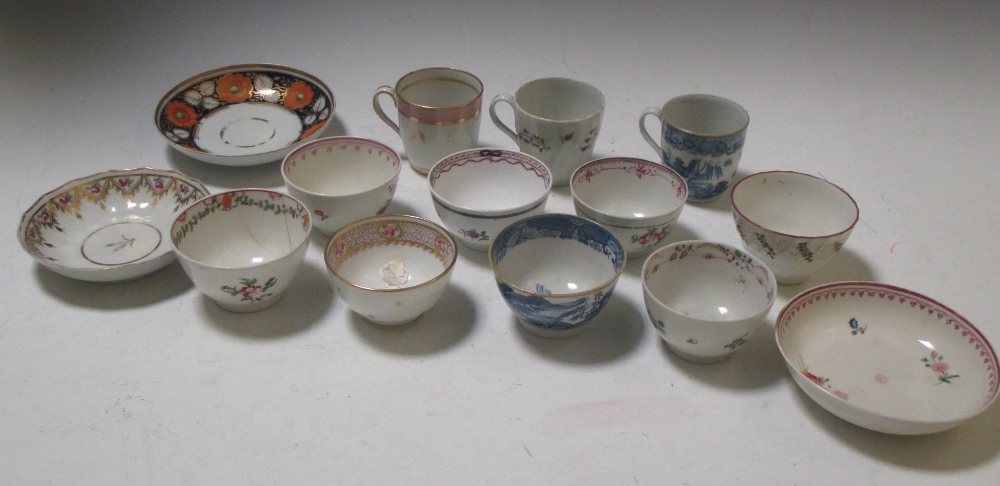 Eight New Hall tea bowls, to include one with the blue and white 'Trench and Mortar' pattern,