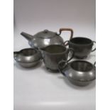 A Tudric pewter three piece teaset, and another sugar and creamer, a Moore & Wright micrometer (