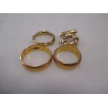 Two 22ct wedding bands (13.7g), another precious yellow metal ring (3.3g) and a large lifering clasp