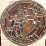 A 19th century stained glass circular panel with Jesus on the Cross