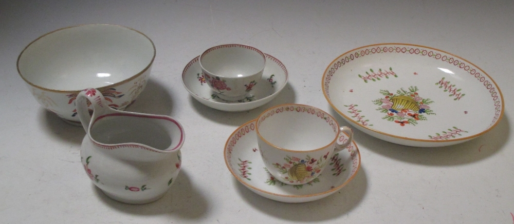 A New Hall 1045 pattern dish, tea cup and saucer, 594 pattern milk jug, tea cup and saucer and a 480