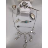 A quantity of jewellery to include a moonstone fringe necklace, a labradorite set scorpion, a gold