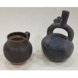 A South American black pottery stirrup bottle together with a Henan glazed mug