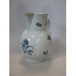 A Worcester blue and white mask jug, 21cm (8.25 in) high  A chip on the spout tip has been filled