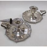 A pair of late Victorian silver chambersticks, one lacking extinguisher