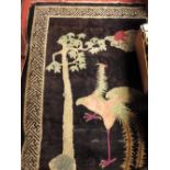 A Chinese blue rug with exotic bird motif, and various other small size Chinese and other rugs,