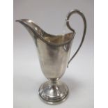 A silver helmet creamer