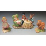 A Beswick model of 'Mad Hatters Tea Party', 'Alice' and 'The Cheshire Cat' (3)