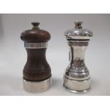 A silver pepper grinder, and another silver mounted (2)