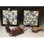 Two Minton Iznik tiles in ebony frames 24 x 24 cm together with two wooden animals and an ibis (5)