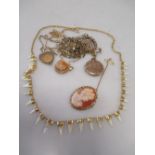 A quantity of gold jewellery to include a 9ct locket, a St Christopher pendant, agate pendant, cameo