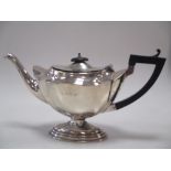 A silver tea pot