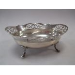 A silver bonbon bowl on four feet
