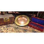 A red leather jewel case by J.Turner, London; a worn lacquer box; a brass dish with raised rim,