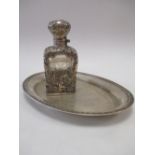 An 800 silver mounted glass scent bottle together with an oval tray