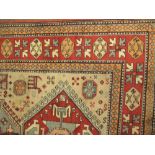 A machine woven Kazak style rug, 222 x 140cm