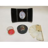 A cased portrait miniature of an elderly lady together with a papier mache snuff box, an ivory