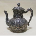 A white metal floral embossed teapot and two Masonic medals