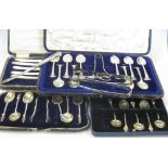 A Mappin and Webb cased set of teaspoons and tongs (incomplete), two other cased sets of