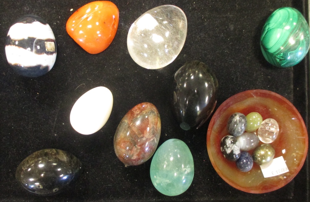 A jasper bowl, a Chinese jasper peach pendant and various stone egg hand coolers