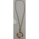A double-sided vitrine pendant with yellow metal chain, gross 29g