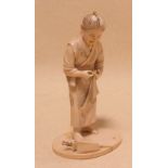 A late 19th/early 20th century Japanese ivory figure