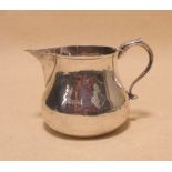 A Britannia standard silver milk jug by Richard Comyns, London 1926, 11cm high, 13.15oz