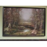 A framed print of a pond in a forest clearing