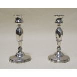 A pair of silver candlesticks (2)