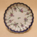 An 18th century Worcester plate painted with floral chains