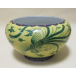 A Chinese yellow ground planter and a bowl and cover decorated with seal marks (2)
