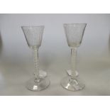 A pair of 18th century conical airtwist glasses engraved with fruiting tree and butterfly (2)
