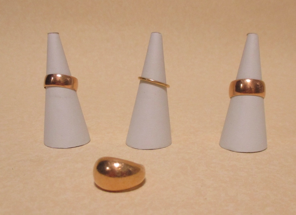 Four various precious yellow metal rings (test as 18ct, 23.3g) and a quantity of other yellow metal,