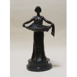 An Art Deco style bronze of a water carrier