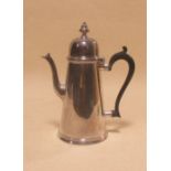 An early 20th Century silver hot water jug and cover, 16oz