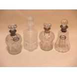 A pair of silver mounted glass decanters, another and a glass decanter (4)