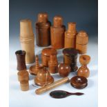 A good collection of treen, mostly boxwood, comprising various bottle cases, string boxes, cased