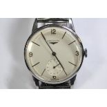 By Longines - an early 1960's gentleman's steel cased wristwatch, the silvered dial with Arabic
