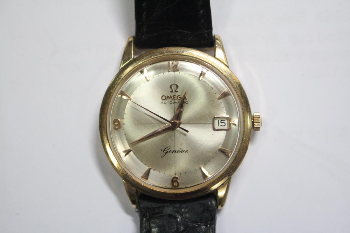 By Omega - an early 1960's gentleman's gold plated automatic wristwatch, champagne coloured dial