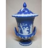 A Wedgwood blue jasperware pot pourri and cover, (25cm high) together with a green jasperware