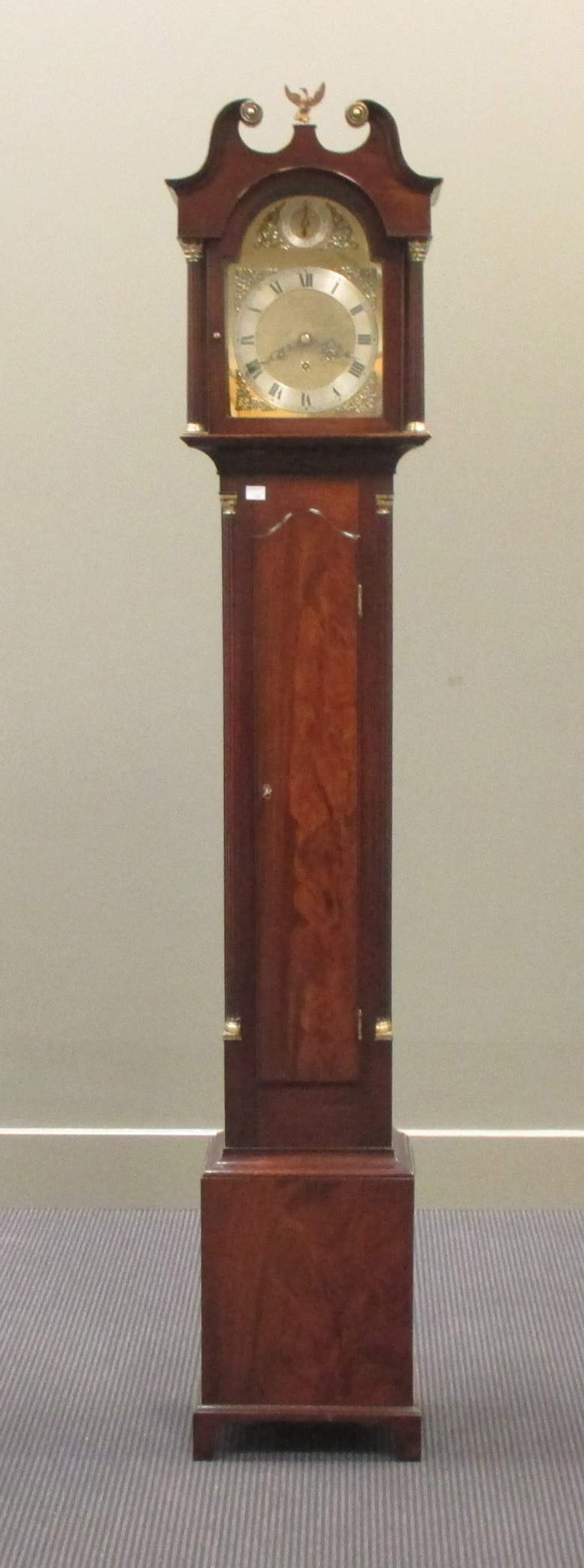 A mahogany grandmother chiming three train clock, with arched brass dial, 20th century, 175cm high