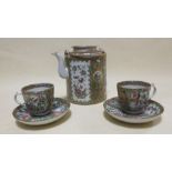A Cantonese enamel teapot together with two tea cups and saucers (5)