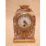 An early 20th century French ormolu mounted marble round arch mantel clock, 14cm high
