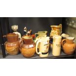Three Doulton Harvest jugs, various whisky, water jugs etc