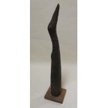 A Sepik wooden horn carved as a bird