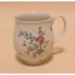 Attributed to Bow, an 18th century polychrome floral mug  the mug has been smashed and restored, the