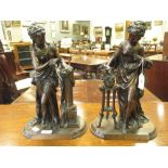 A pair of early 20th century bronze figures of Classical ladies, 36cm high