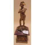 A bronze figure of Napoleon standing on a purple marble base, 35cm high